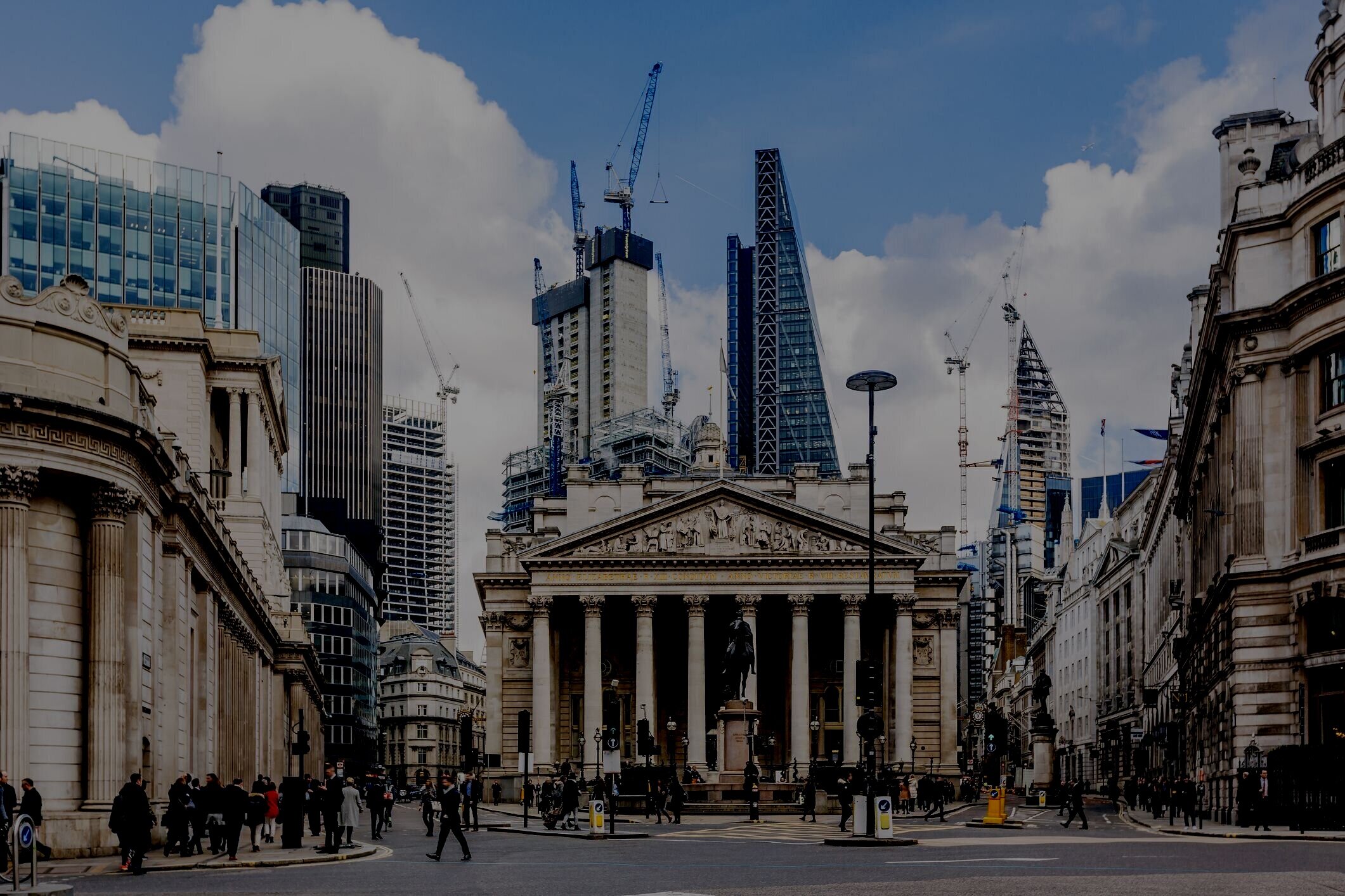 street-in-city-of-london-with-royal-exchange--bank-of-england-and-new-modern-skyscrapers--england--uk-923317900-cc8daffff0da44d38a6aacd70b8204cf.jpg